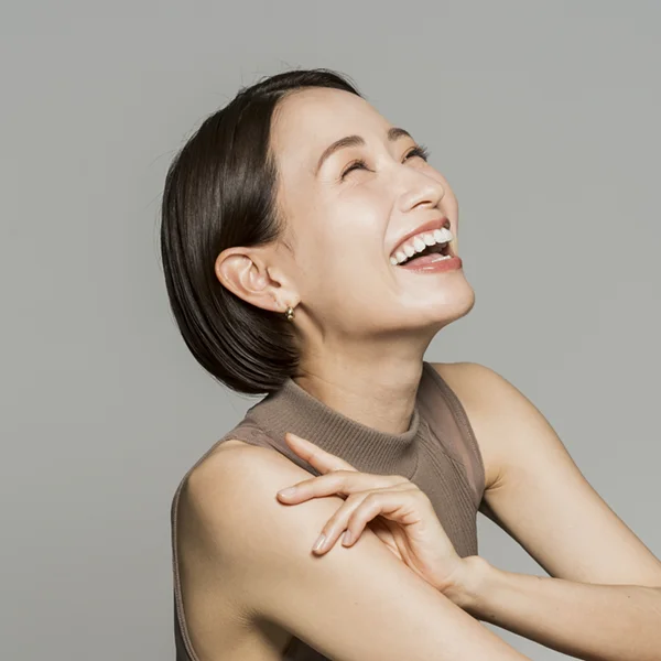 candid shot of an adult woman laughing and smiling